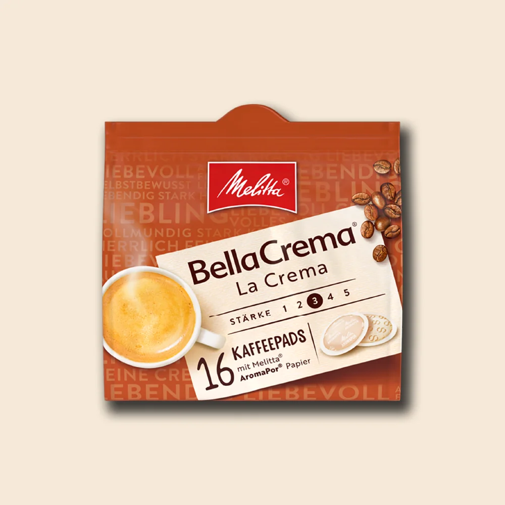 Produktbild der Melitta La Crema Pads auf beigem Hintergrund