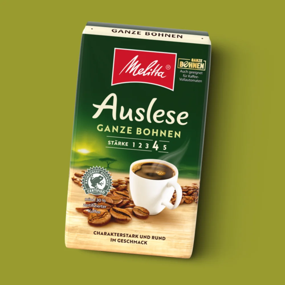 Packshot der Melitta Auslese ganze Bohne auf grünem Hintergrund