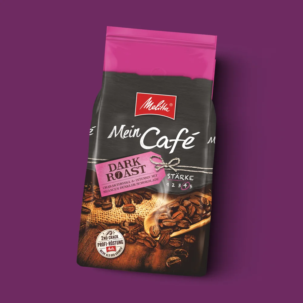 Bild einer Packung Melitta Mein Café Dunkelröstung auf violettem Hintergrund