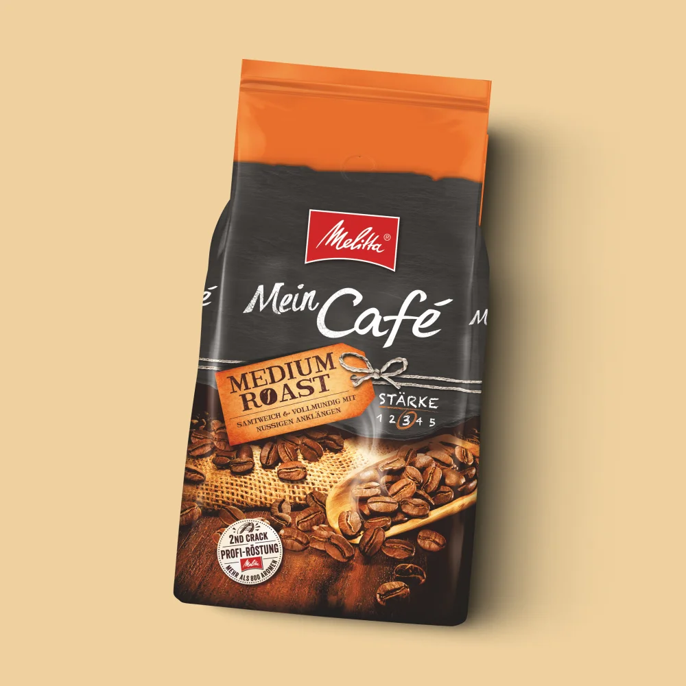 Bild einer Packung Melitta Mein Café Medium Roast auf beigem Hintergrund