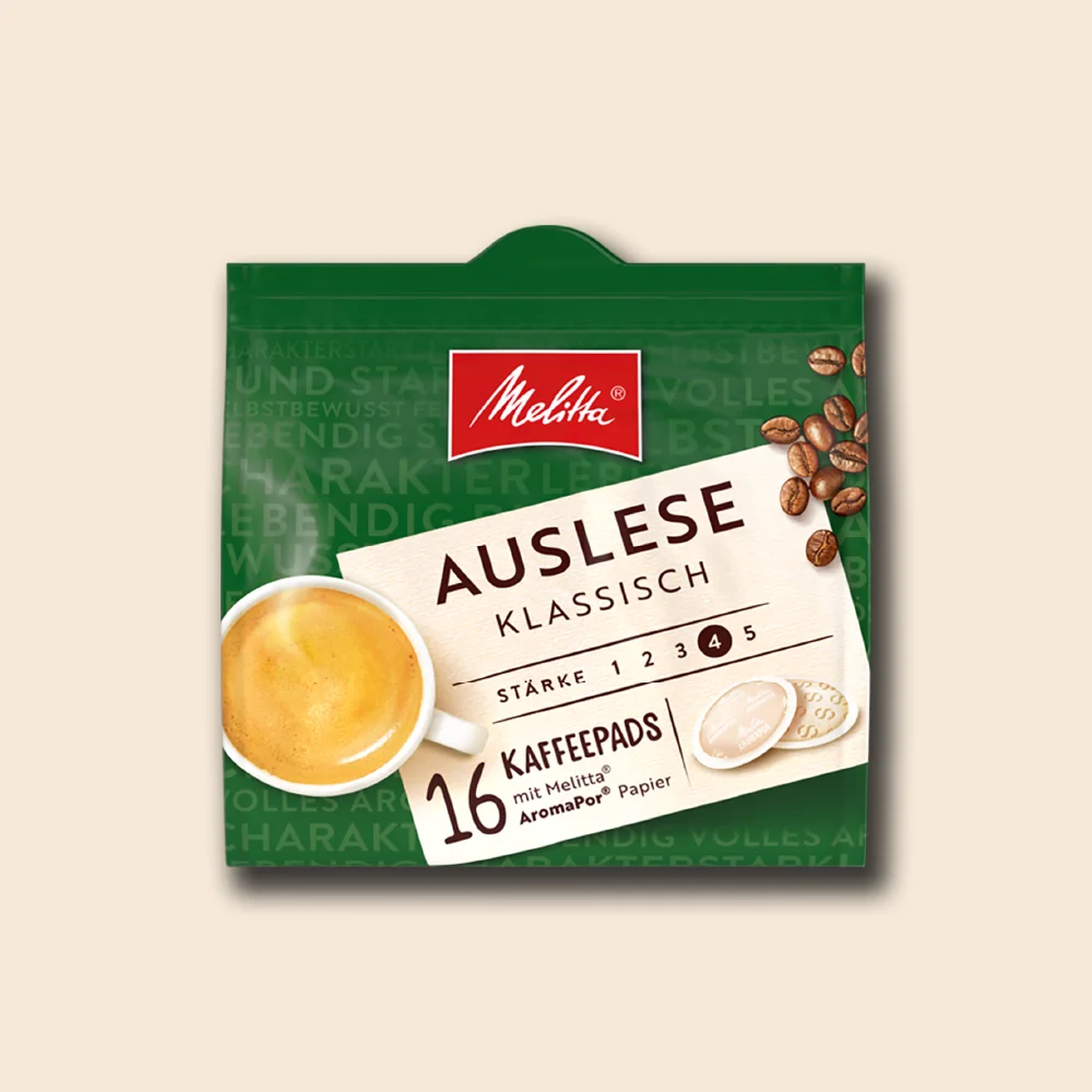 Produktbild der Melitta Auslese Pads auf beigem Hintergrund