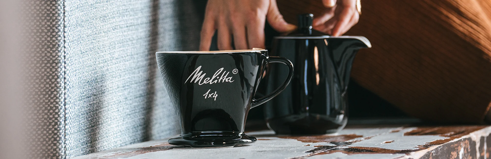 Image of a jug and a black porcelain filter stand
