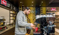 a Borussia Dortmund footballer preparing a Melitta coffee