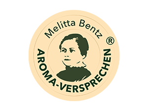 Ein Siegel mit dem Abbild von Melitta Bentz und dem Schriftzug „Aroma-Versprechen“ ist zu sehen.