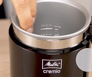 Image of someone touching the adhesive and easy-to-clean coating of our cremio.