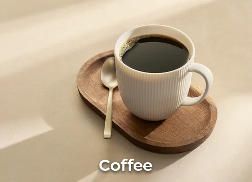 A cup of coffee standing on a wooden tablet